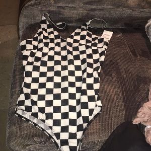 A Black & White Checkered Body Suit